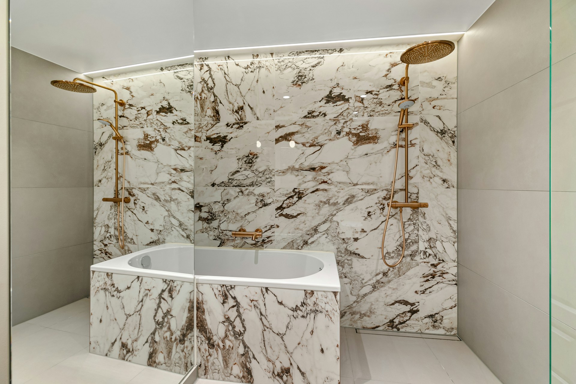 Luxury marble bathroom with gold rain shower