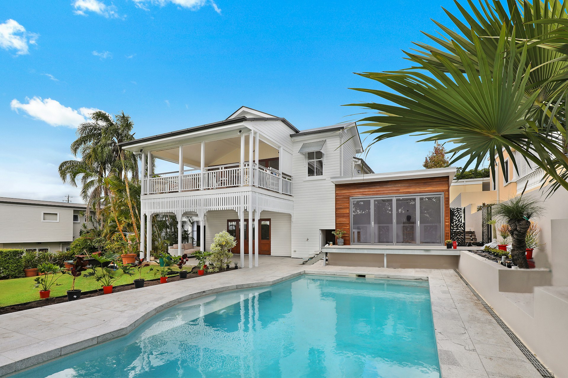 Renovated weatherboard villa with pool and palms